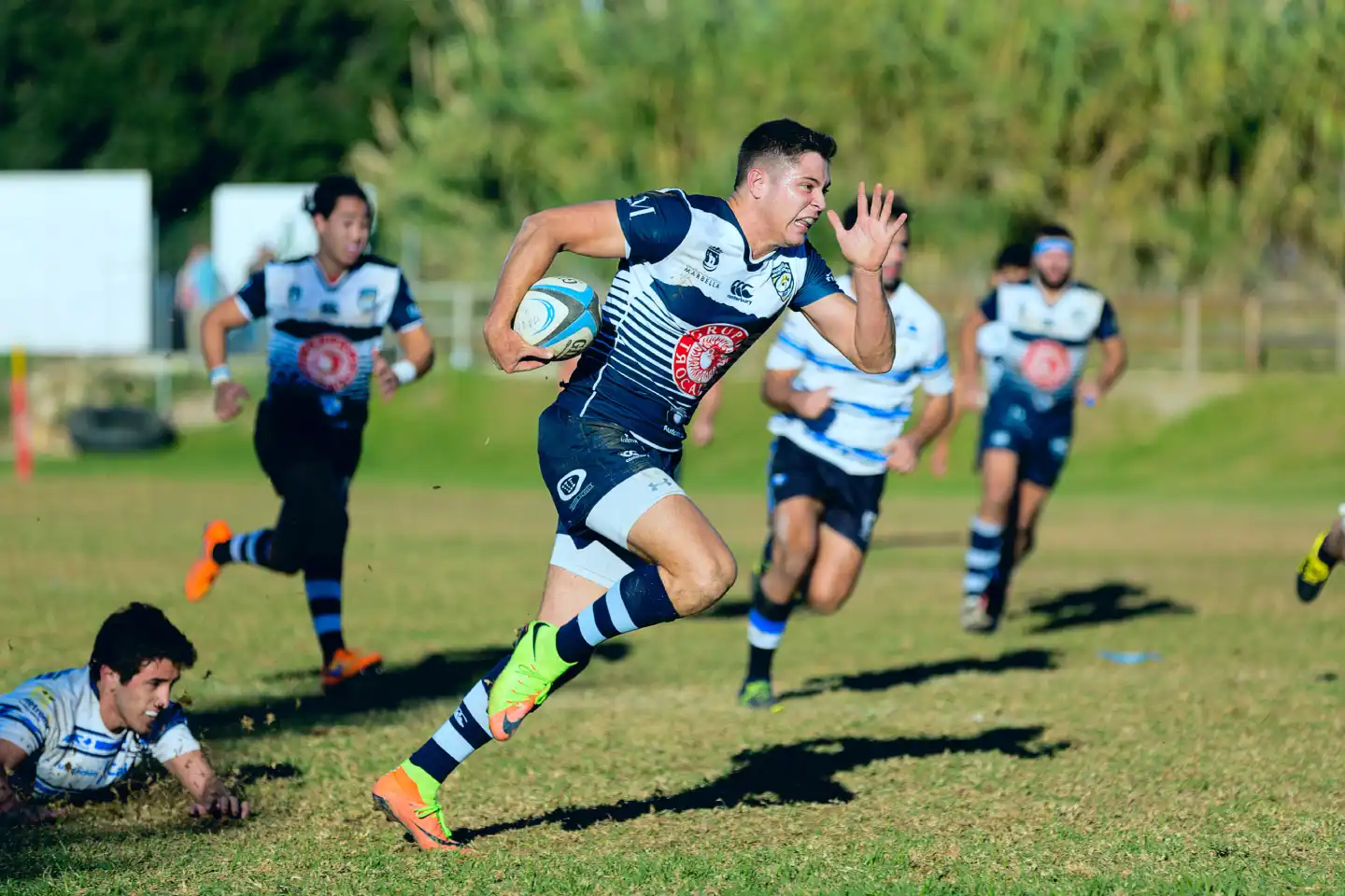 man-football-running-field
