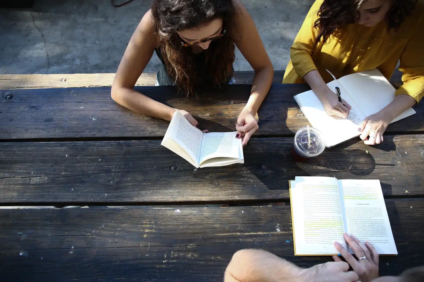 woman-reading-book-while-sitting-on-chair