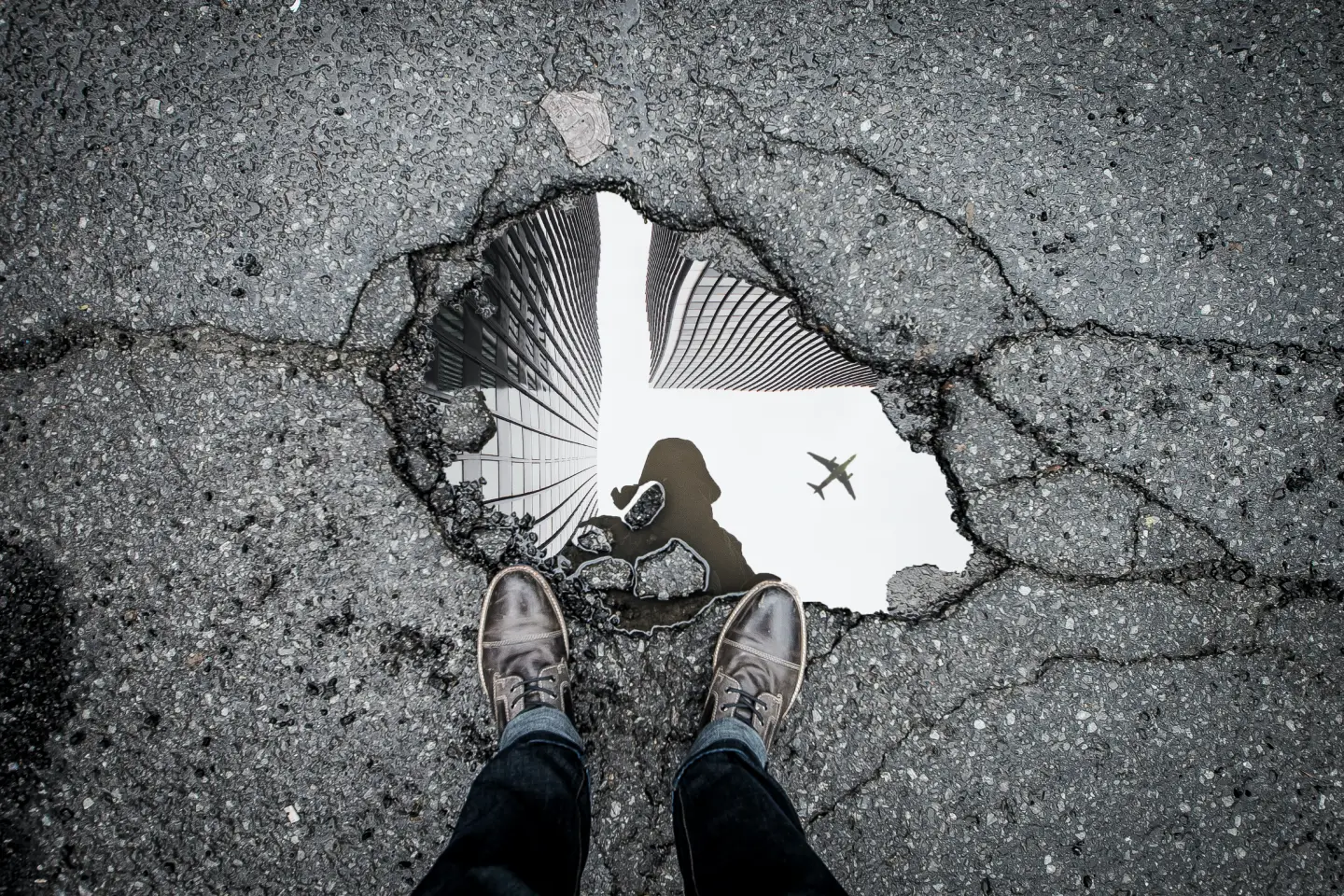 road-puddle-reflection-man